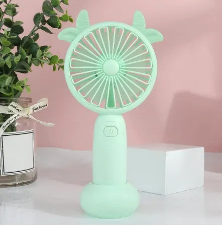Handheld mini USB rechargeable fan with cartoon design in blue, green, pink, or yellow colours