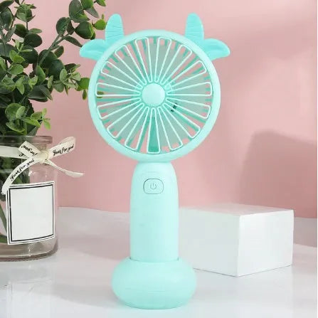 Handheld mini USB rechargeable fan with cartoon design in blue, green, pink, or yellow colours