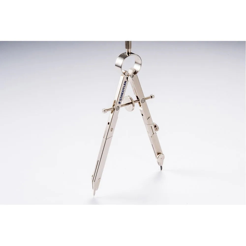 STAEDTLER steel precision car compass with extended telescopic rod on a drafting surface