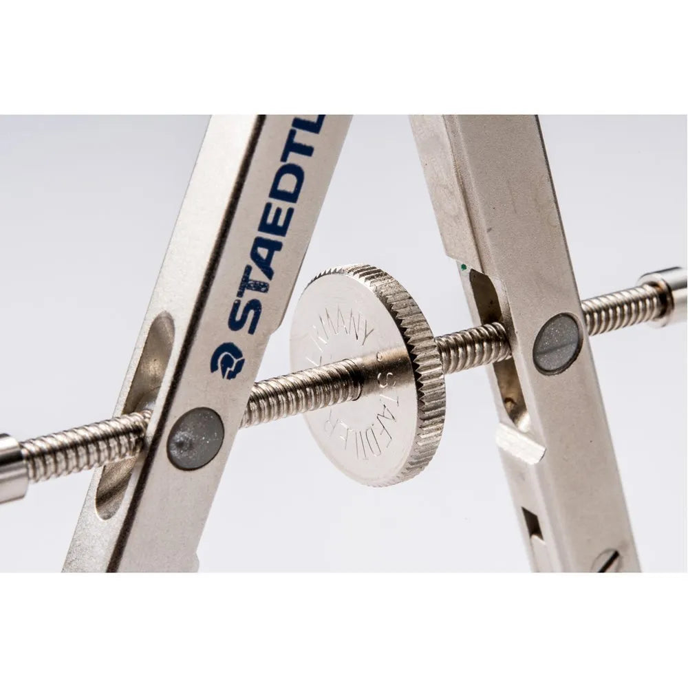 STAEDTLER steel precision car compass with extended telescopic rod on a drafting surface