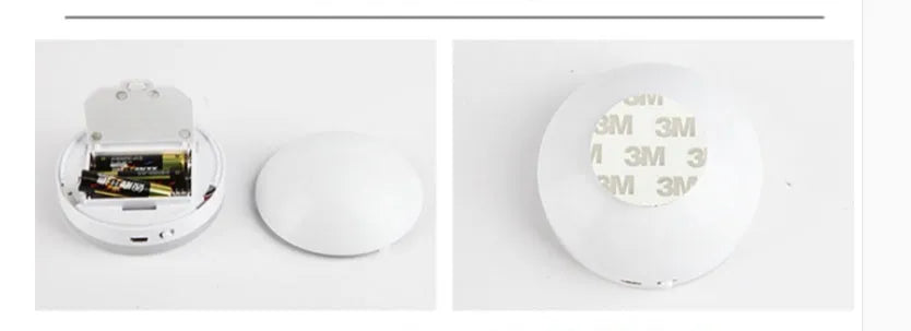 Two small wireless motion-sensor LED night lights placed in a dark hallway.
