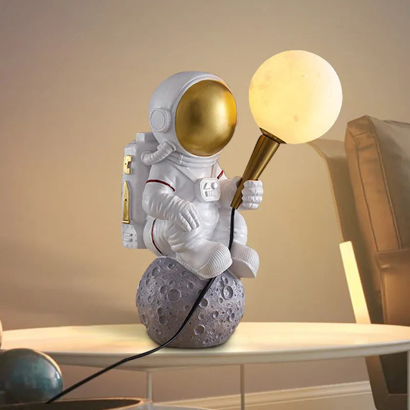 White astronaut desk lamp with night light function in seated, standing and wall-mounted styles