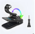 Silver and black Gopro backpack mounting clip with 360-degree rotating head on a backpack strap.
