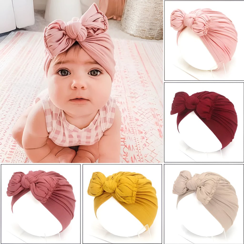 Soft acrylic knitted baby hat in a solid colour, shown on a mannequin head, suitable for newborns and infants.