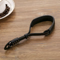 Black leather wrist strap attached to digital camera with small anchor point
