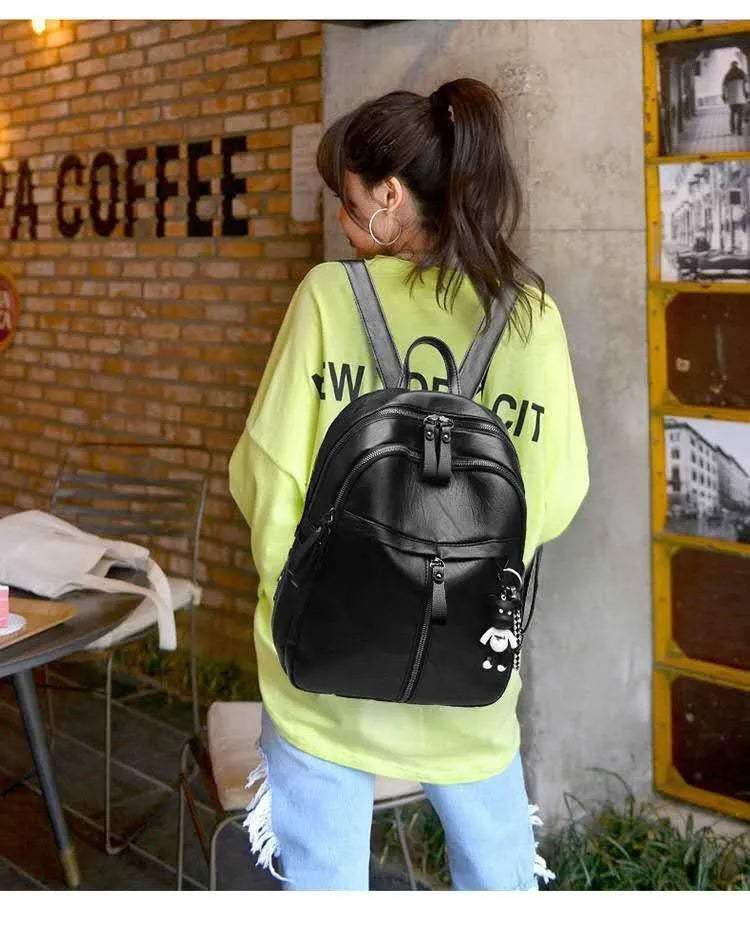 Black pu leather backpack with double straps showing soft surface texture and medium size profile