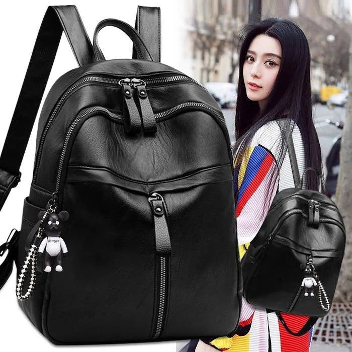 Black pu leather backpack with double straps showing soft surface texture and medium size profile