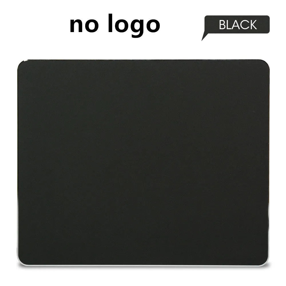 Aluminium alloy double-sided mouse pad in black finish on a desk for gaming or office use