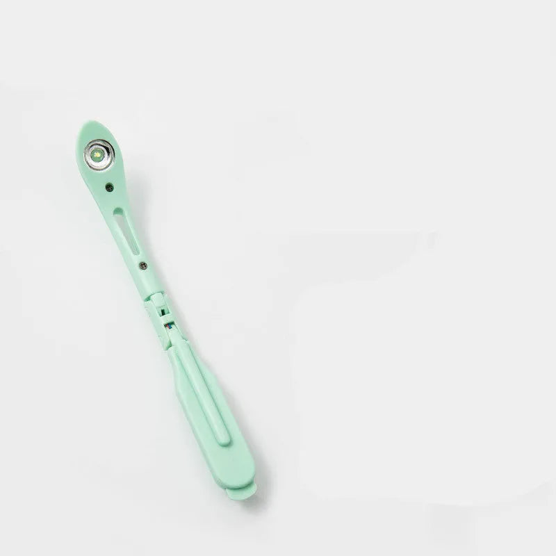 Folding book light with night light function in blue, green, pink, or yellow colour options.