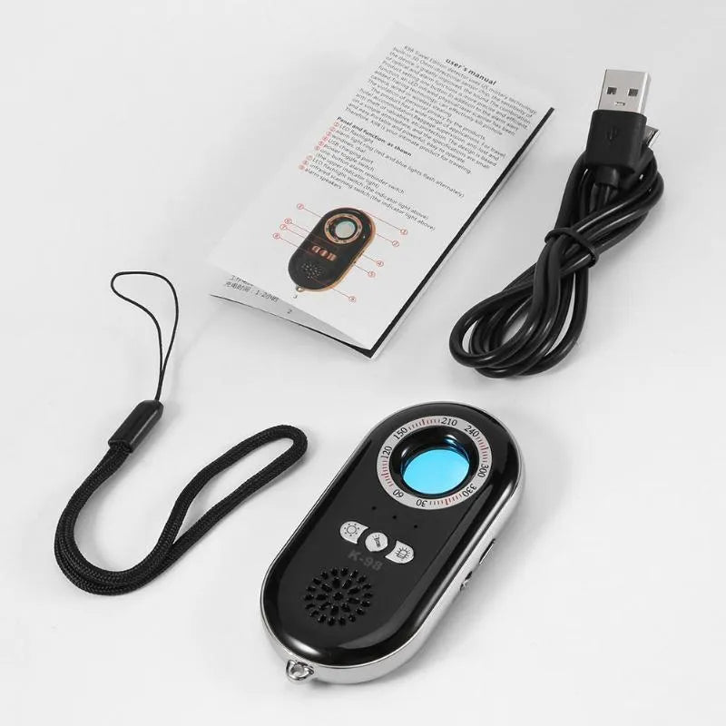 Compact black wireless signal detector and anti-theft alarm with vibration sensor.