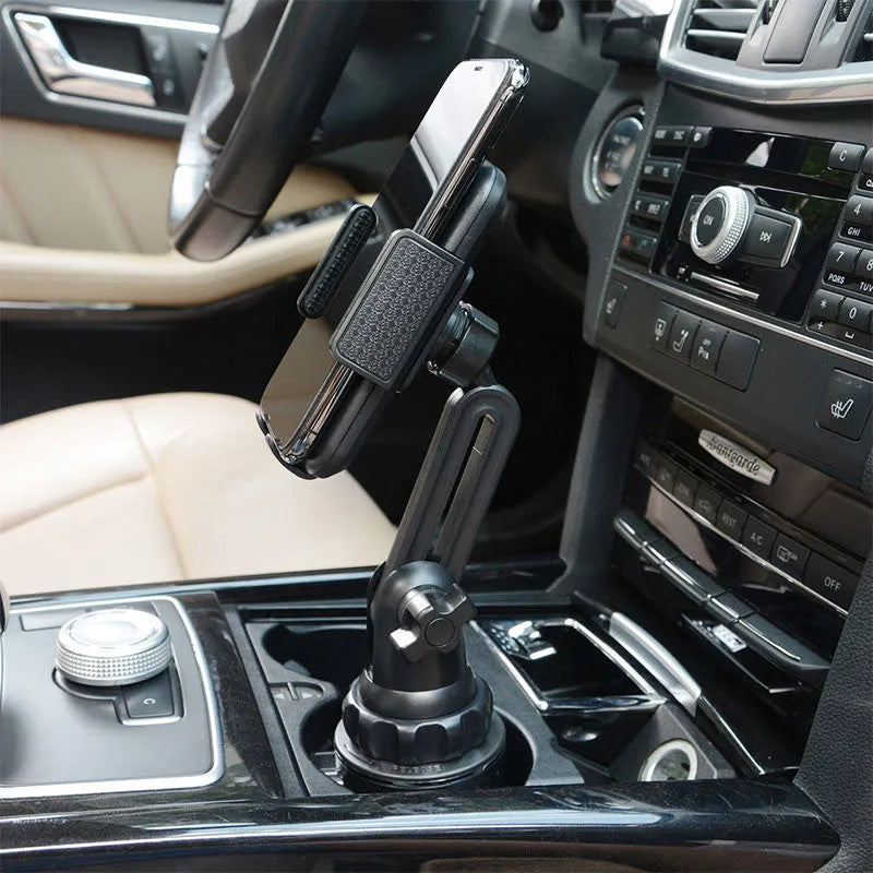 Black ABS car phone holder with adjustable arm and 360-degree rotating head on a buckle base.