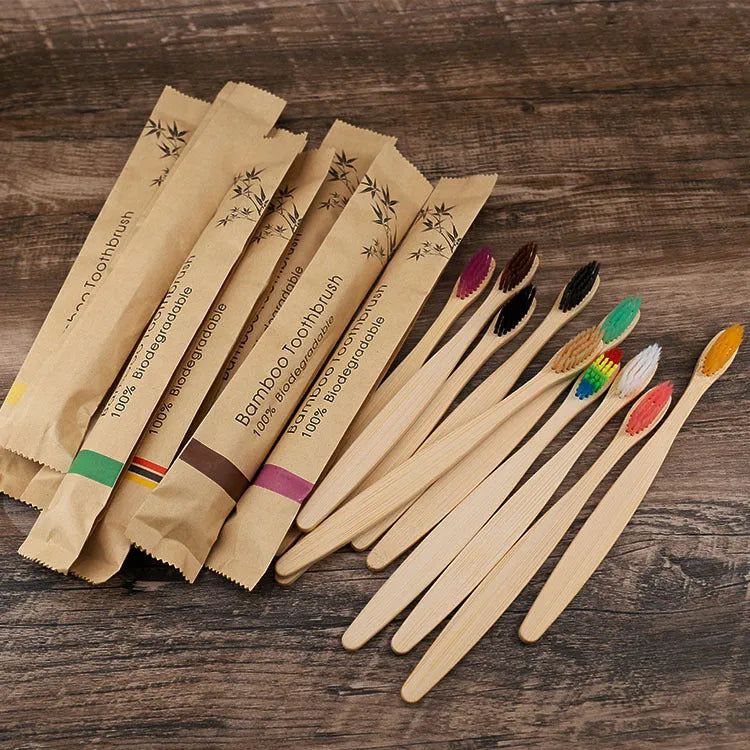 Set of 10 bamboo toothbrushes in multiple colours showing natural bamboo handles and soft bristles