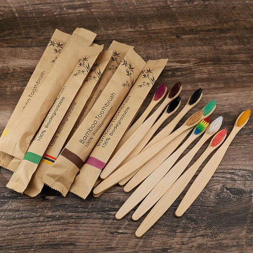 Set of 10 bamboo toothbrushes in multiple colours showing natural bamboo handles and soft bristles