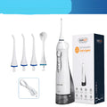 White portable oral irrigator with large water tank and multiple nozzles on a bathroom counter