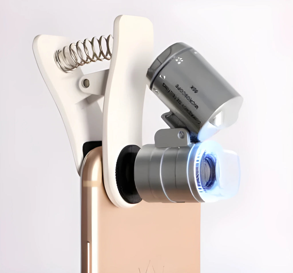 White 60X universal mobile phone clip magnifier attached to smartphone camera for macro photography