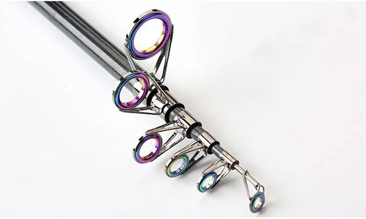 Carbon fibre telescopic spinning fishing rod with metal handle, extended, on a boat deck.