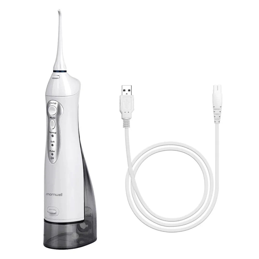 White portable oral irrigator with large water tank and multiple nozzles on a bathroom counter