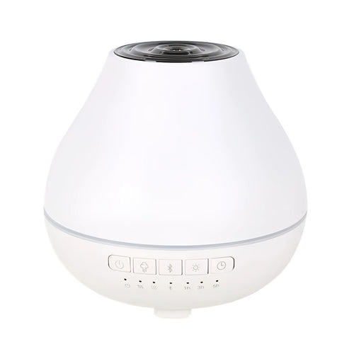 White round Bluetooth humidifier and aroma diffuser with night light on wooden surface