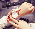 Retro art women tie watch with round alloy case and cloth strap in pink