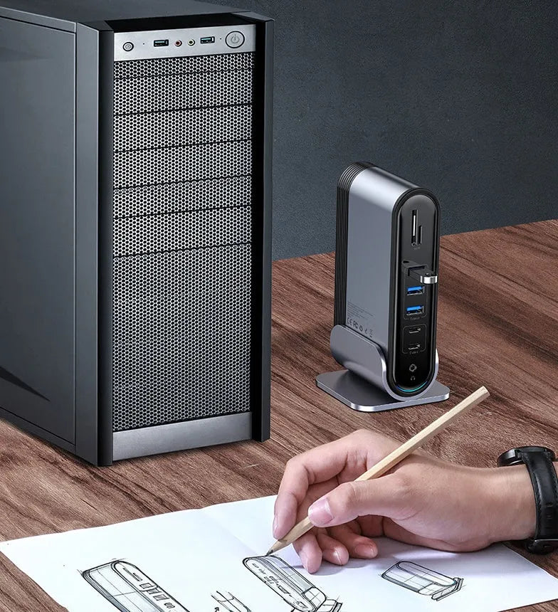 Deep space grey 16-in-1 Type-C docking station hub with multiple ports and external power supply on a desk.