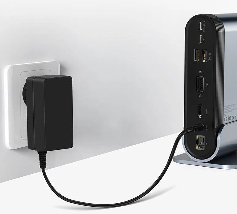 Deep space grey 16-in-1 Type-C docking station hub with multiple ports and external power supply on a desk.