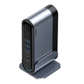 Deep space grey 16-in-1 Type-C docking station hub with multiple ports and external power supply on a desk.