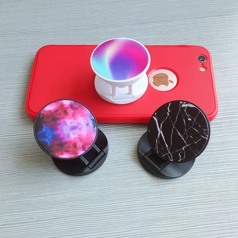 Folding mobile phone stand on desktop showing thermal transfer aluminium sheet variant