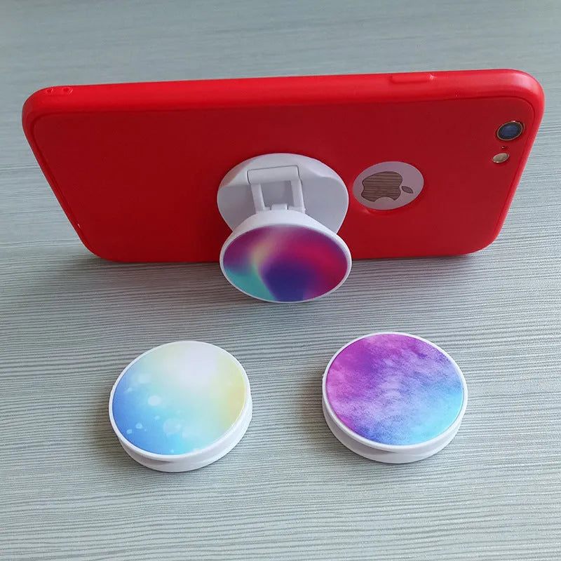 Folding mobile phone stand on desktop showing thermal transfer aluminium sheet variant