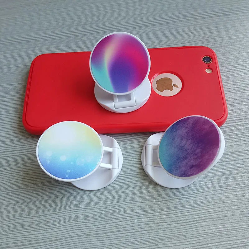 Folding mobile phone stand on desktop showing thermal transfer aluminium sheet variant
