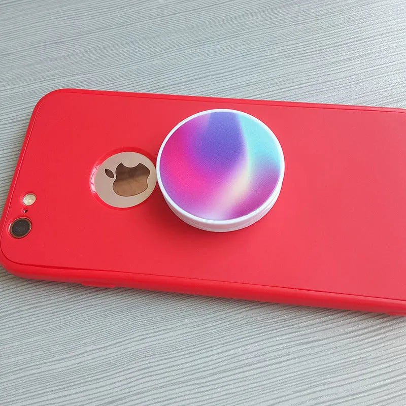 Folding mobile phone stand on desktop showing thermal transfer aluminium sheet variant
