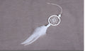 White mini dreamcatcher pendant 5cm on a wall as home decor