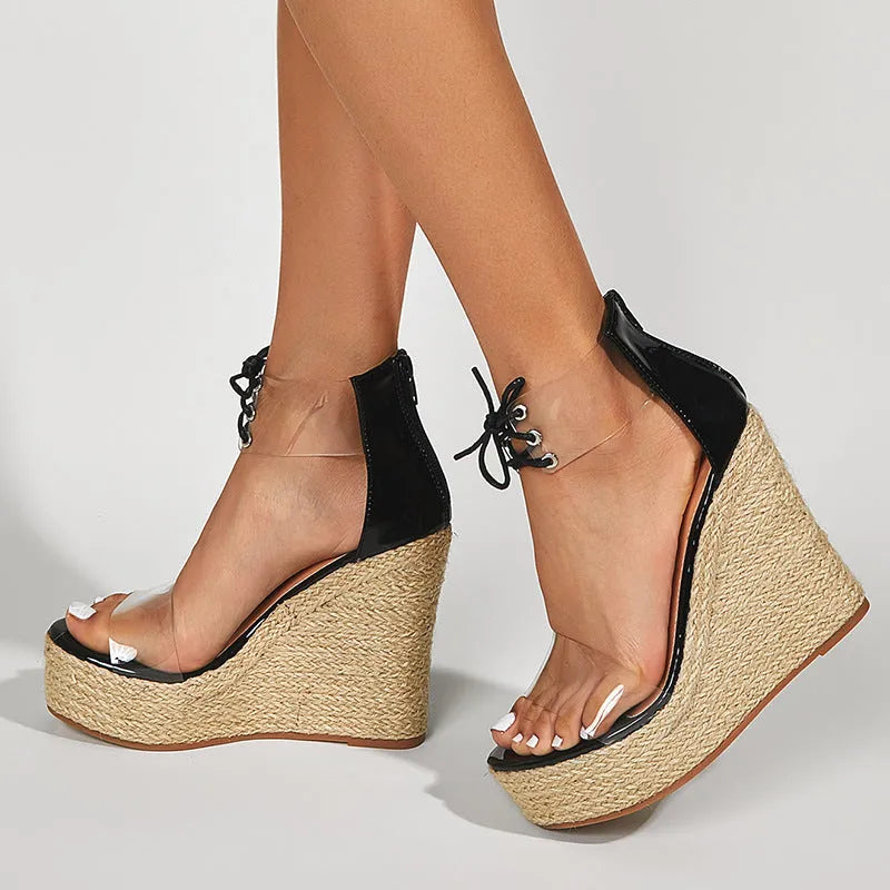 Black women's wedge sandals with hemp rope front tie on a super high platform heel.