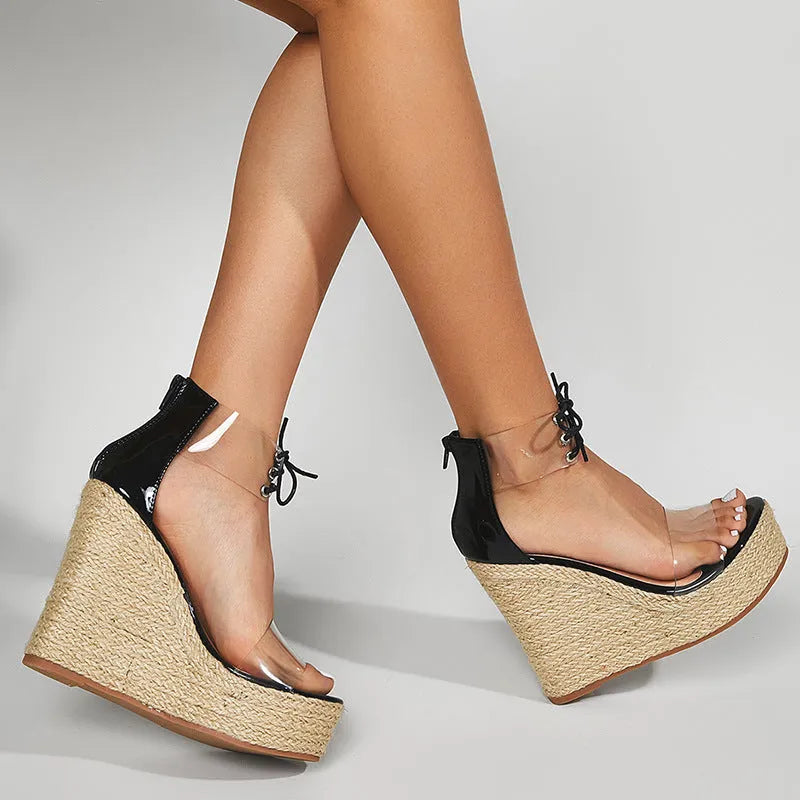 Black women's wedge sandals with hemp rope front tie on a super high platform heel.
