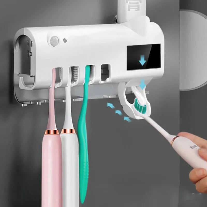 Black intelligent UV toothbrush steriliser and automatic toothpaste squeezer unit mounted on a bathroom wall.