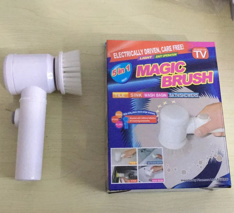 White cordless electric cleaning brush with three interchangeable brush heads on a bathroom sink