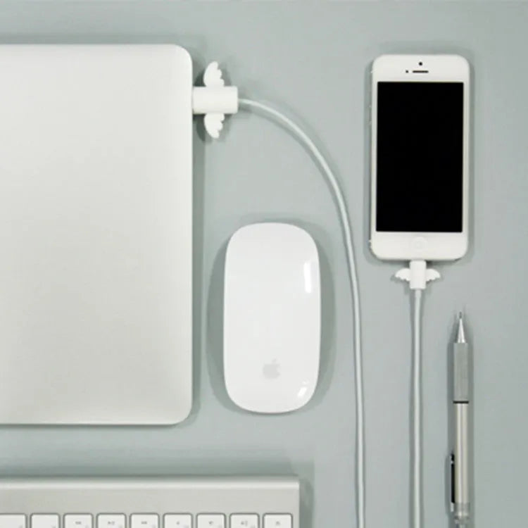 White and black silicone cable protective covers shown next to mobile phone charging cable