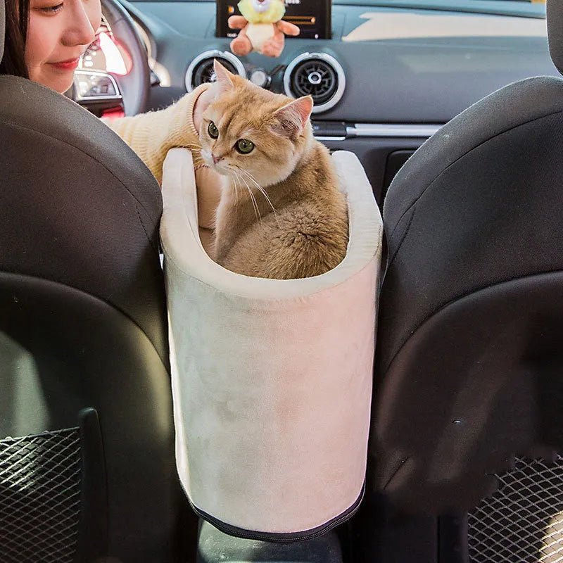 Oval beige car pet mat and dog house measuring 42x20x22cm on a car seat