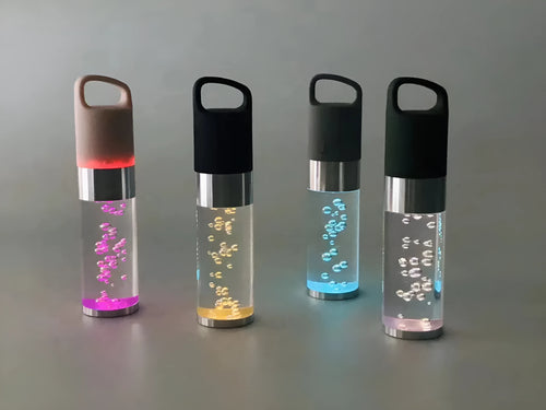 Pink Bluetooth speaker with colourful crystal LED lights showing compact 145mm design