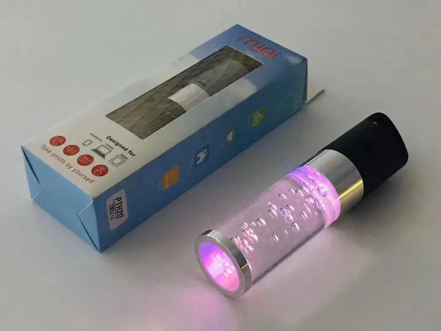 Pink Bluetooth speaker with colourful crystal LED lights showing compact 145mm design