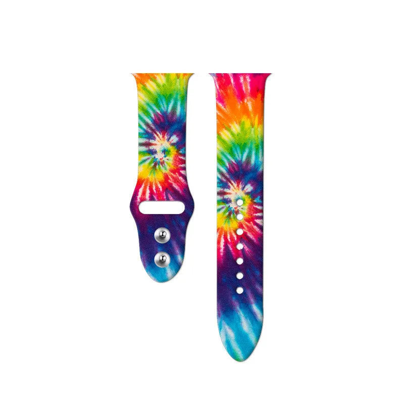 Silicone Apple Watch band in a colourful tie-dye pattern, showing the adjustable strap length.
