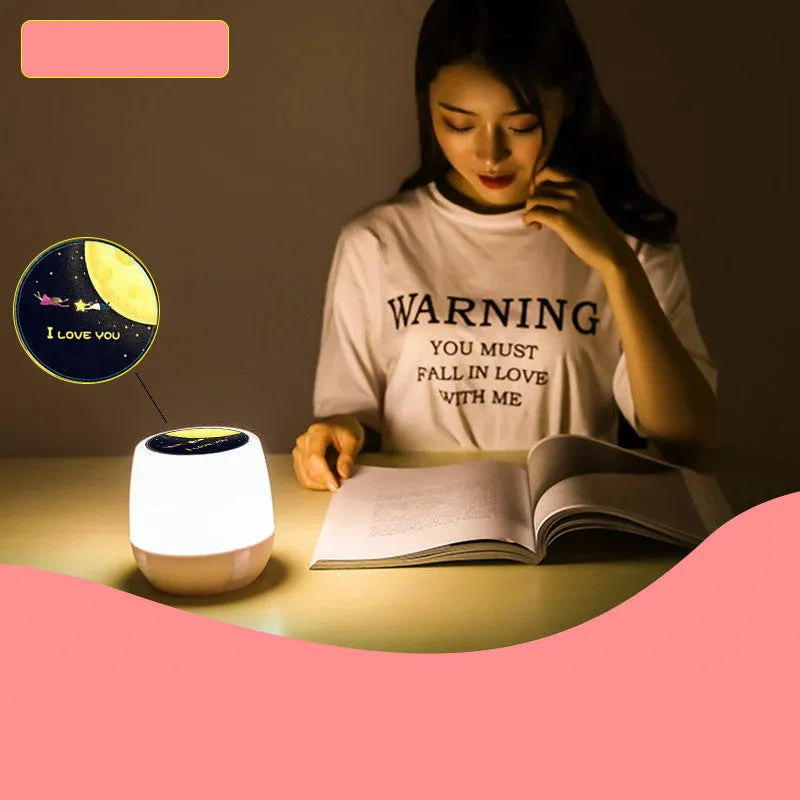 Pruixin PRX1363 rotating LED projector night light showing starry sky patterns on a wall.