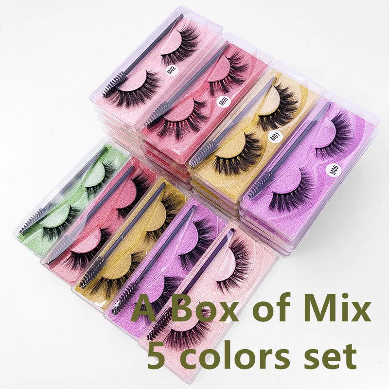 One pair of natural 3D imitation mink false eyelashes in elongated eye tail style with a brush on a white background