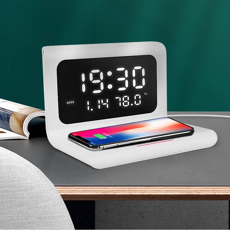 White wireless charger alarm clock showing time, date, temperature and humidity display