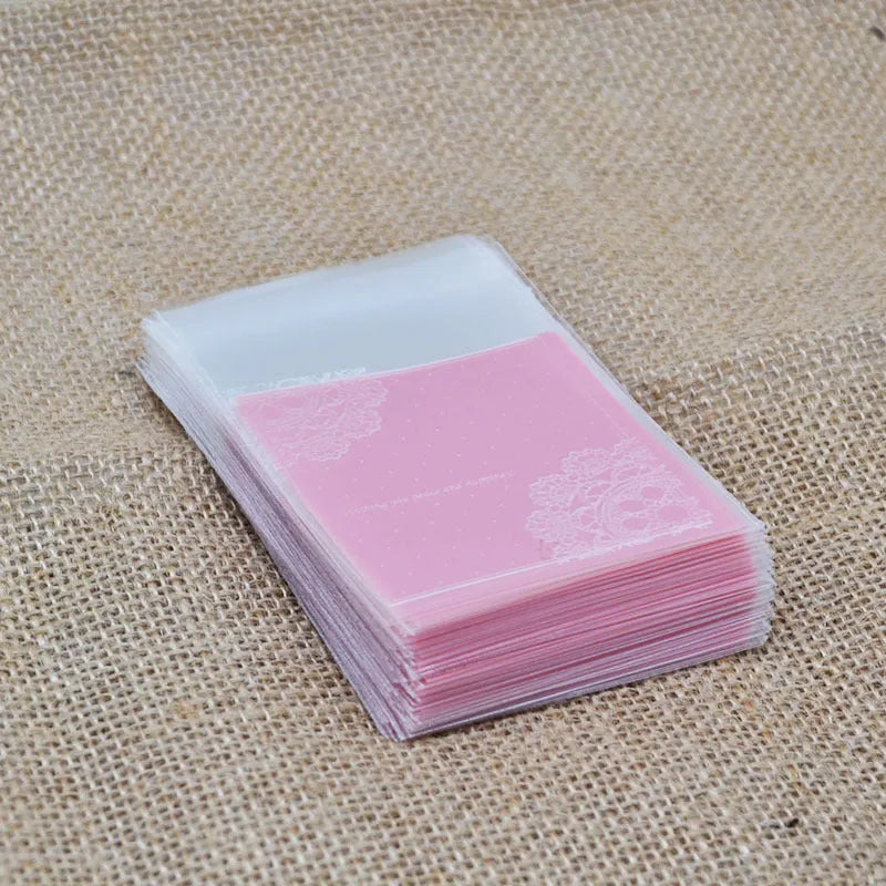 Pink self-adhesive plastic packaging bag with UV printing measuring 7x7cm plus 3cm adhesive flap