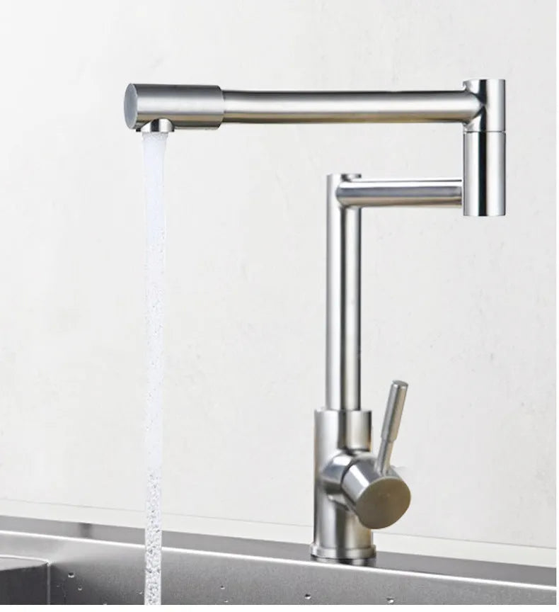 Silver stainless steel dual-control kitchen tap showing 360-degree rotation capability