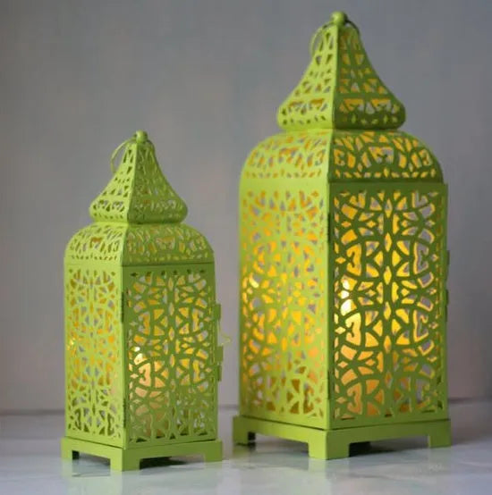 Blue Moroccan style geometric iron candlestick holder with hollow design for decorative lighting.