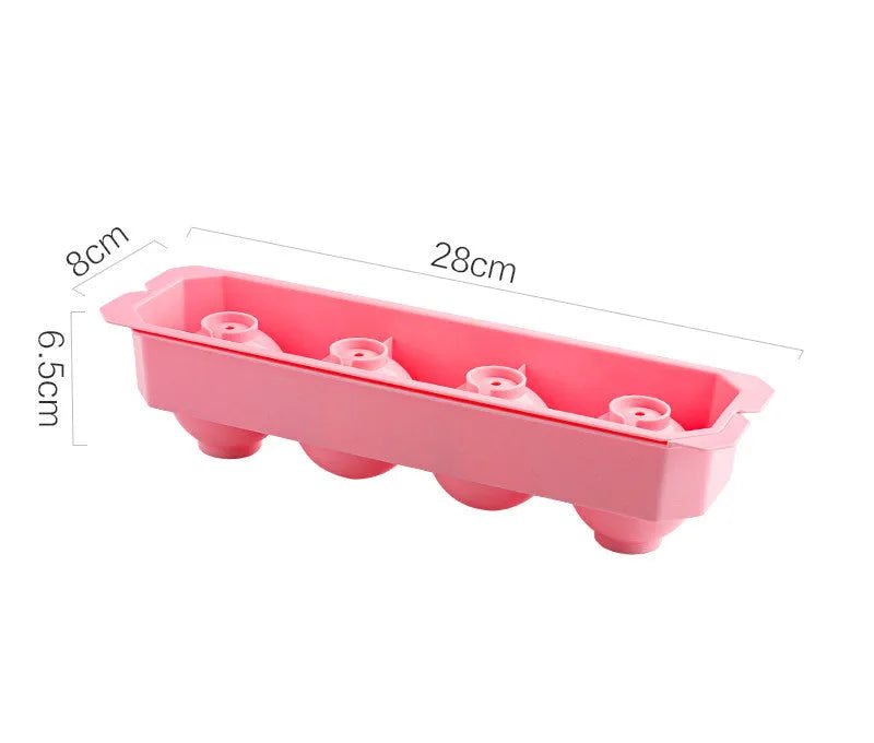 Flexible silicone ice tray producing large hockey puck-shaped ice cubes and other decorative shapes like spheres and pentagons.