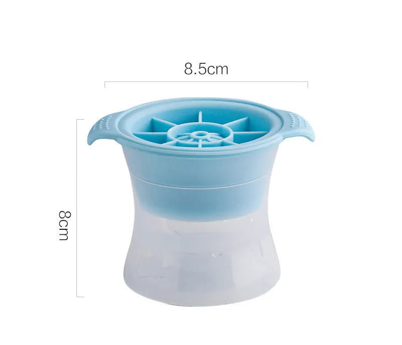 Flexible silicone ice tray producing large hockey puck-shaped ice cubes and other decorative shapes like spheres and pentagons.