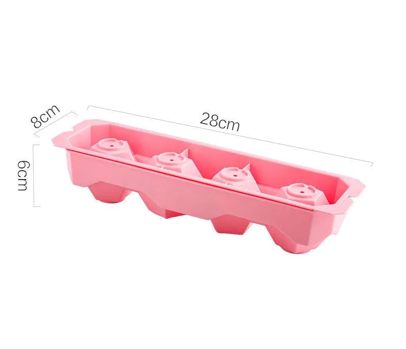 Flexible silicone ice tray producing large hockey puck-shaped ice cubes and other decorative shapes like spheres and pentagons.