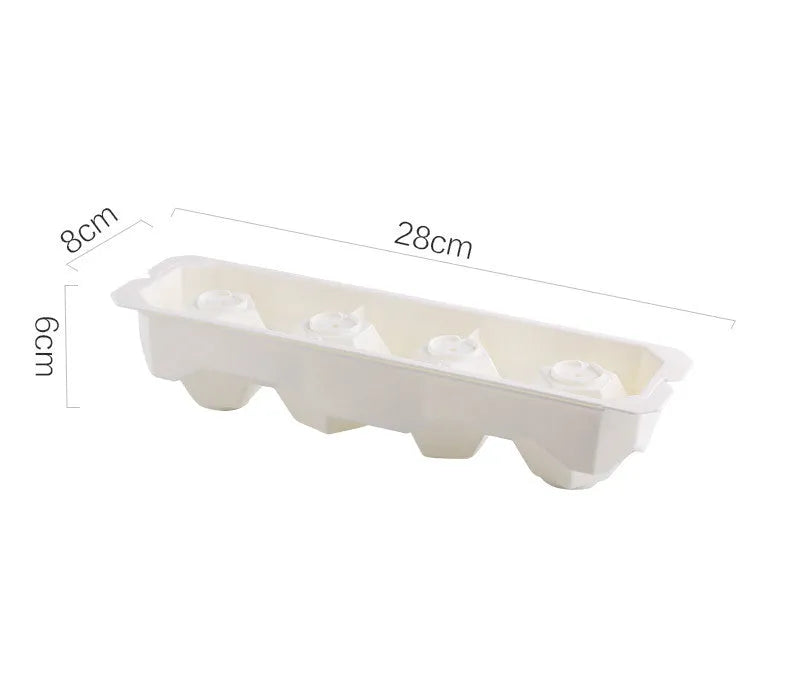 Flexible silicone ice tray producing large hockey puck-shaped ice cubes and other decorative shapes like spheres and pentagons.